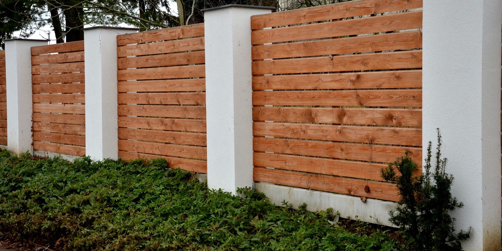 WoodenFenceMadeOfNaturalPlanksTheColumnsAreMade Home Depot fencing