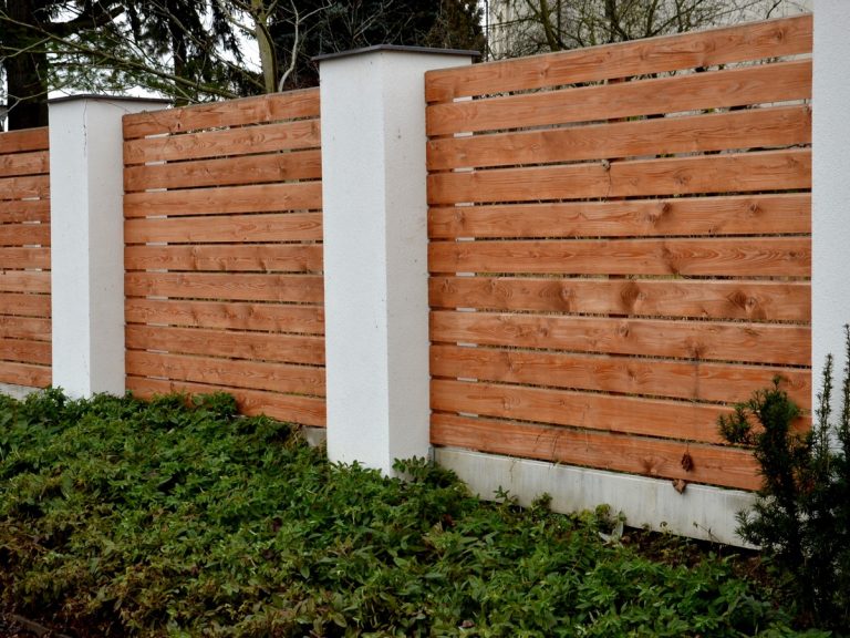 WoodenFenceMadeOfNaturalPlanksTheColumnsAreMade Home Depot fencing