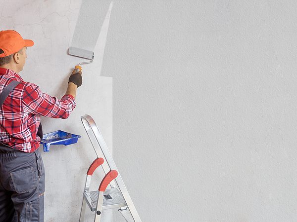 Professional Painter Man Painting Wall In Grey Color Banner Re Home Painting Services